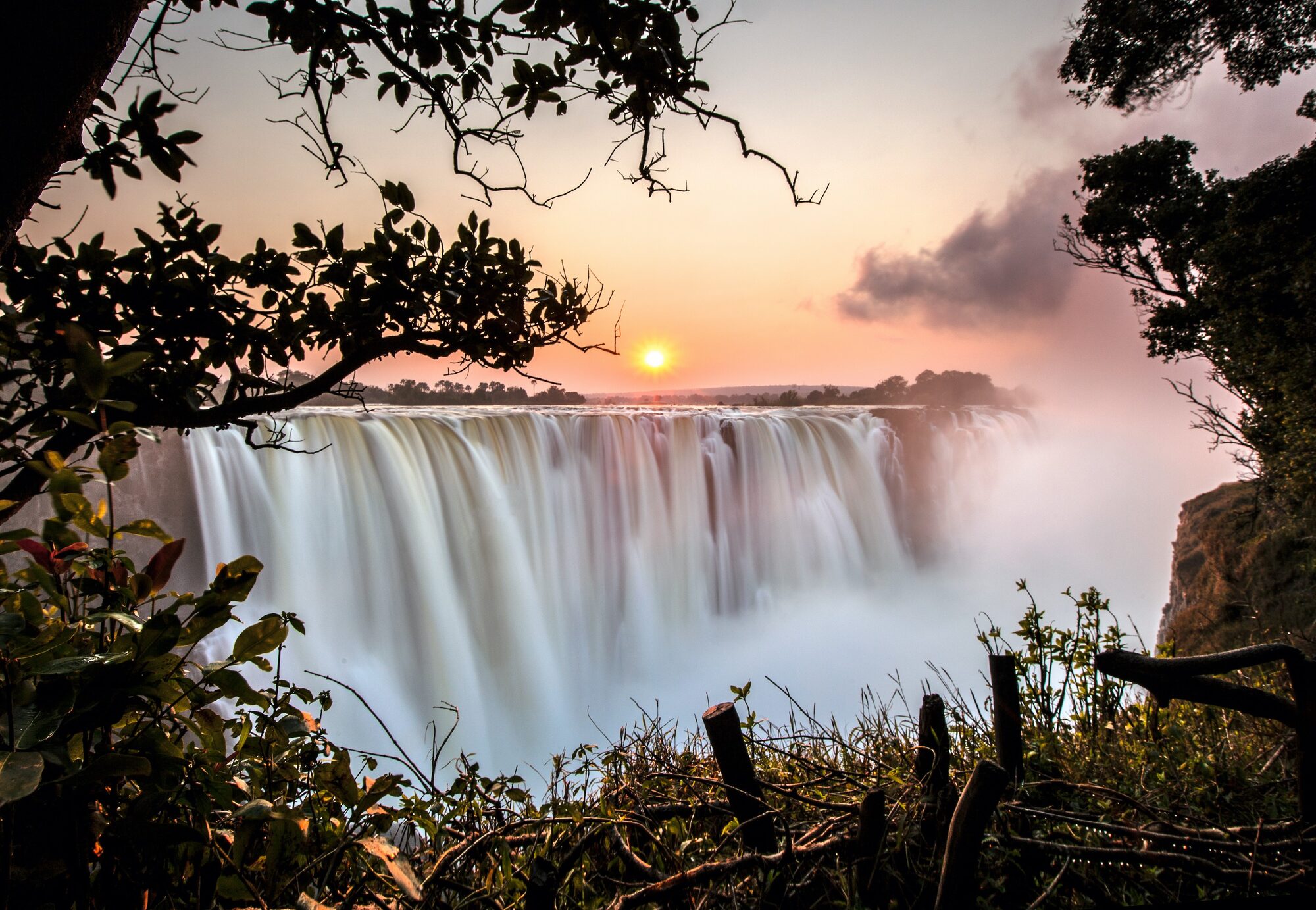 Victoria Falls curtain with the bridge and rising spray