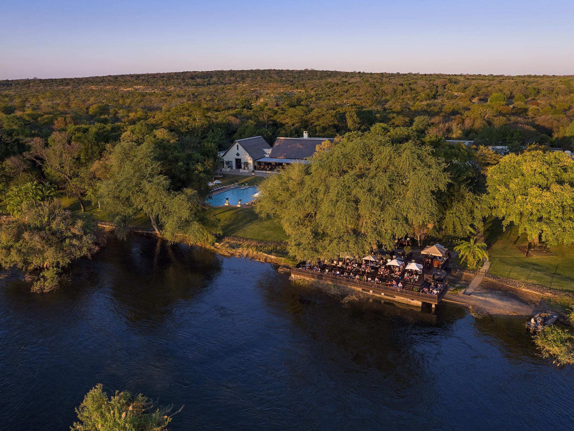Royal Livingstone riverside deck on the Zambezi at sunset